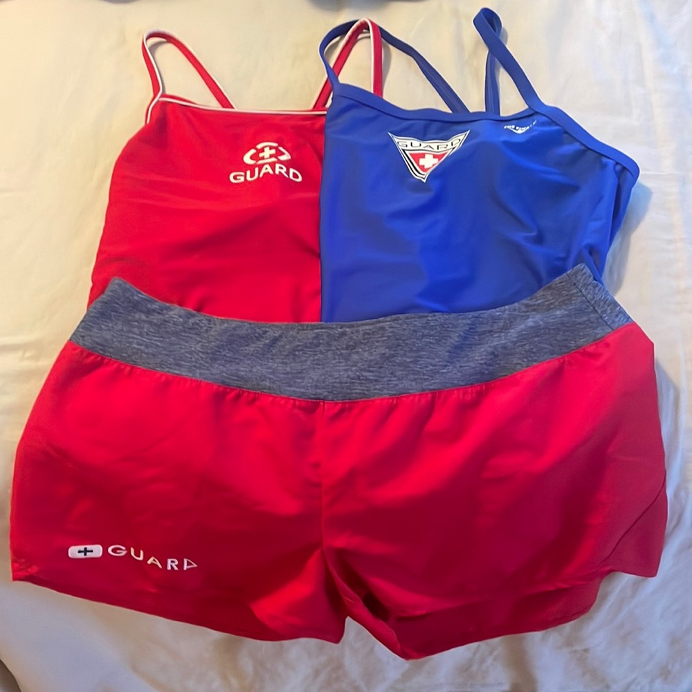 Two Guard Bathing-suits and a pair of guard shorts